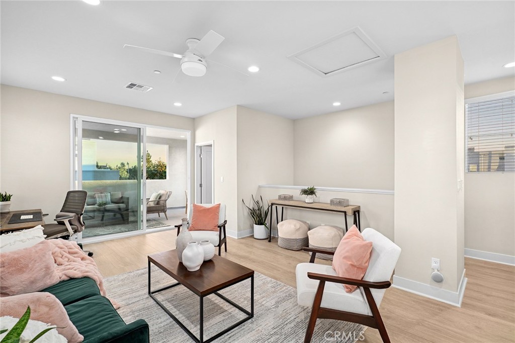 163 Tenor Irvine, CA 92618 - Photo 8 of 40 a living room with furniture and a floor to ceiling window