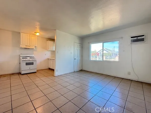 a view of a kitchen with storage and utility