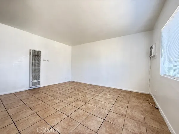 a view of a room with a white wall & dryer