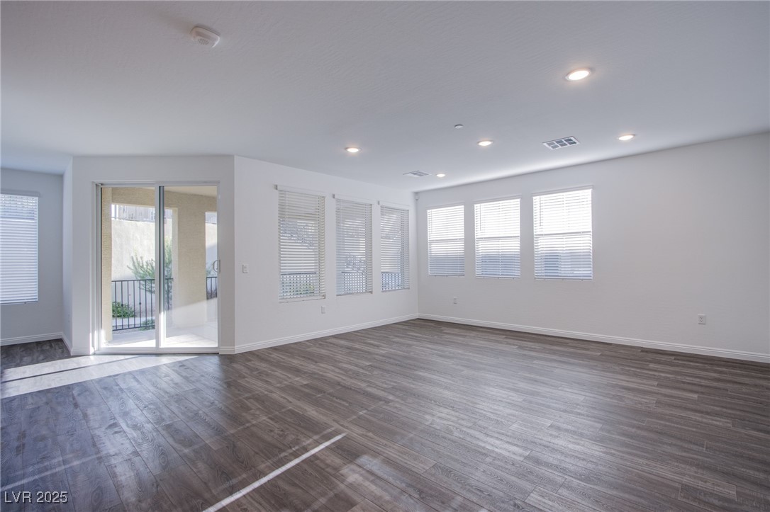 2555 Hampton Road, Unit 4109 Henderson, NV 89052 - Photo 10 of 38 Unfurnished room featuring dark wood-type flooring, recessed lighting, and a smoke detector