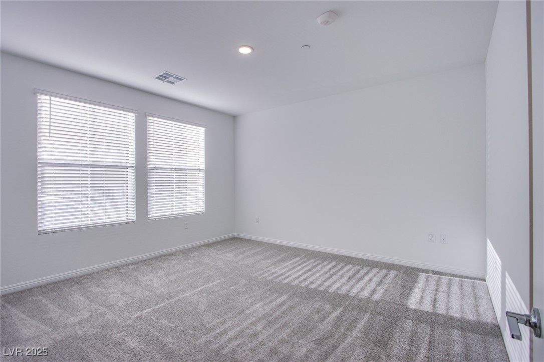 2555 Hampton Road, Unit 4109 Henderson, NV 89052 - Photo 12 of 38 Carpeted empty room featuring baseboards and recessed lighting