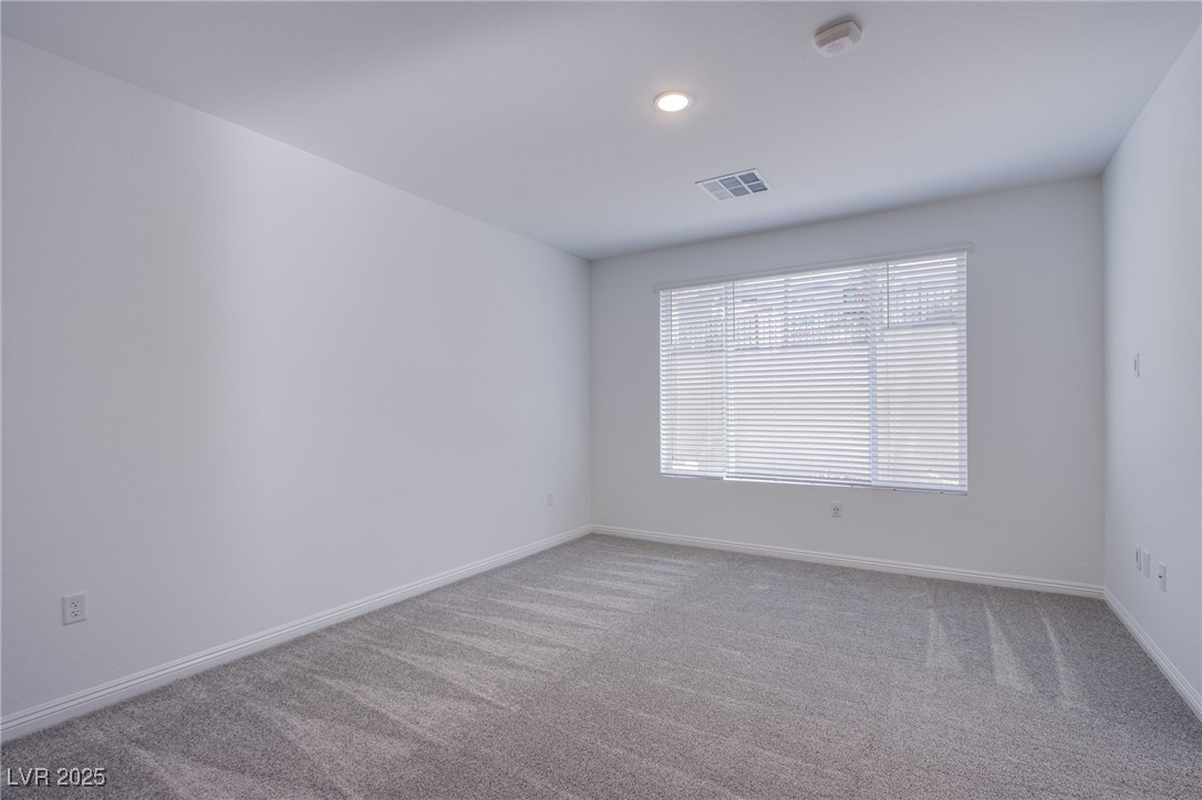 2555 Hampton Road, Unit 4109 Henderson, NV 89052 - Photo 13 of 38 Carpeted spare room featuring a smoke detector and recessed lighting