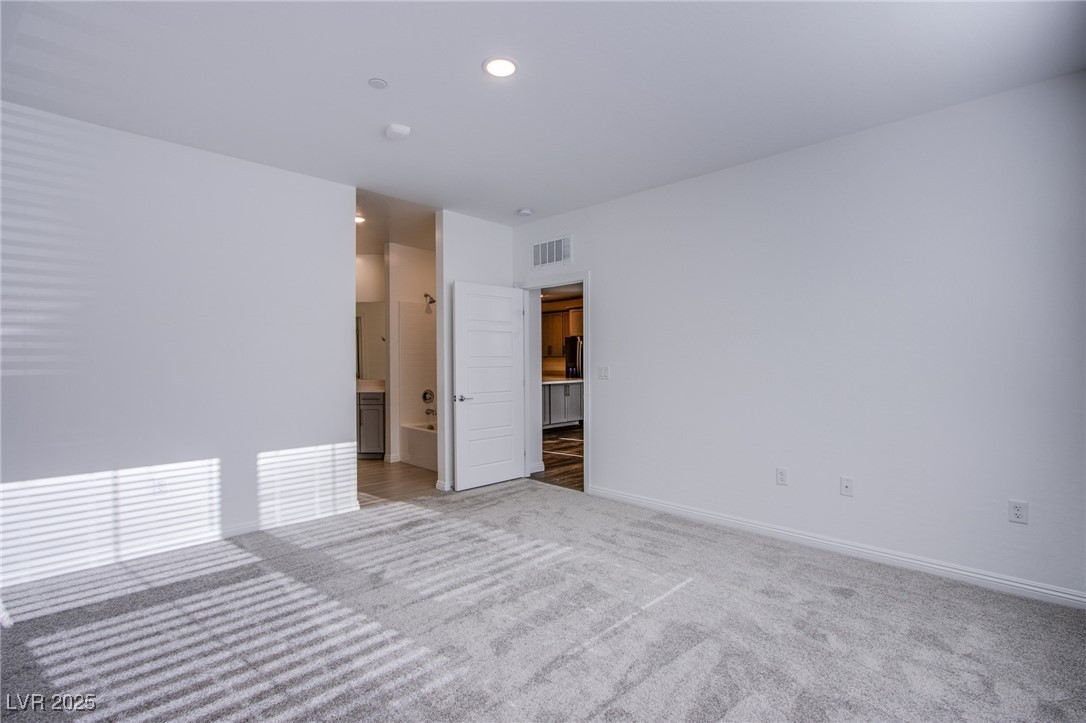 2555 Hampton Road, Unit 4109 Henderson, NV 89052 - Photo 14 of 38 Unfurnished room featuring light carpet and recessed lighting