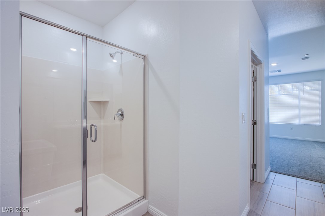 2555 Hampton Road, Unit 4109 Henderson, NV 89052 - Photo 18 of 38 Bathroom with a stall shower and baseboards
