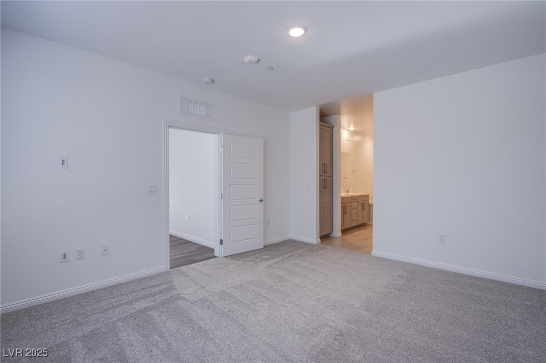 2555 Hampton Road, Unit 4109 Henderson, NV 89052 - Photo 19 of 38 Spare room featuring light colored carpet, recessed lighting, and a smoke detector