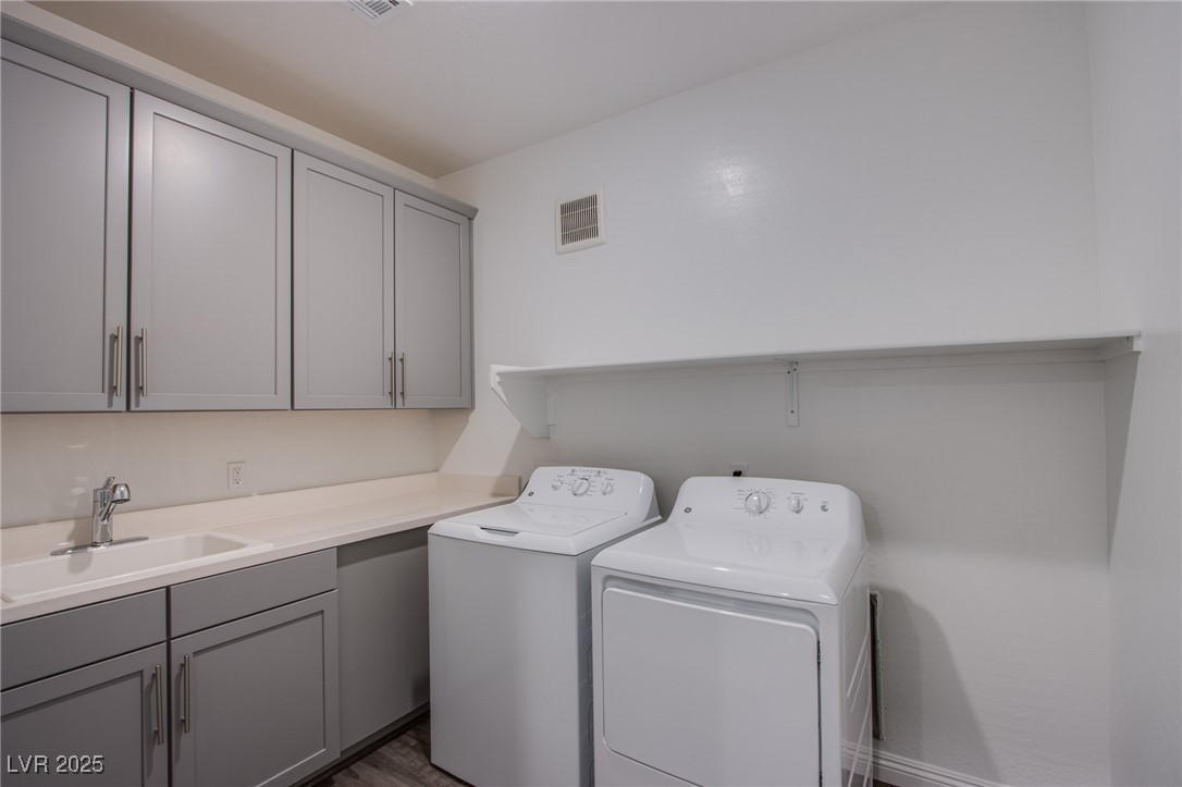 2555 Hampton Road, Unit 4109 Henderson, NV 89052 - Photo 20 of 38 Laundry room with washing machine and dryer and cabinet space