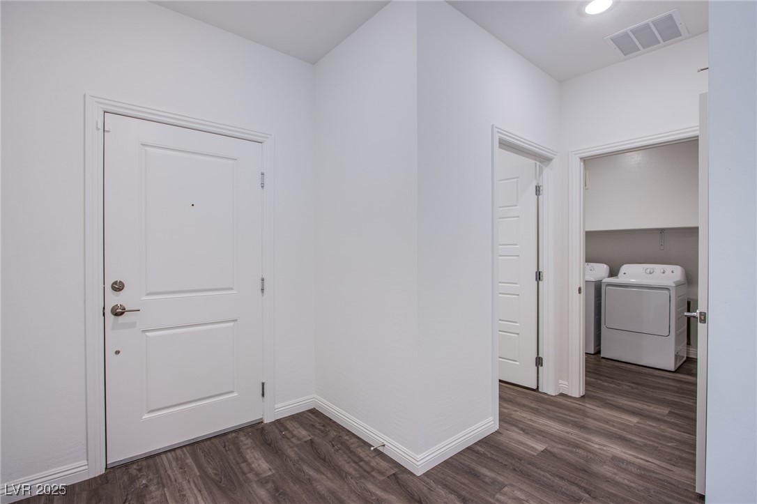 2555 Hampton Road, Unit 4109 Henderson, NV 89052 - Photo 24 of 38 Hall featuring washing machine and dryer, dark wood-style floors, and recessed lighting