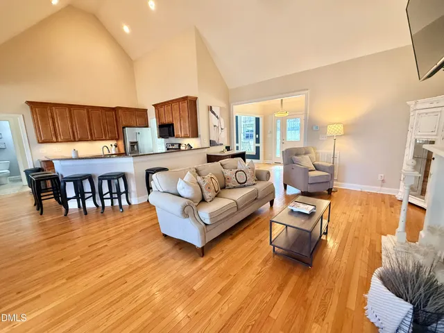 a kitchen with stainless steel appliances granite countertop a sink stove and microwave