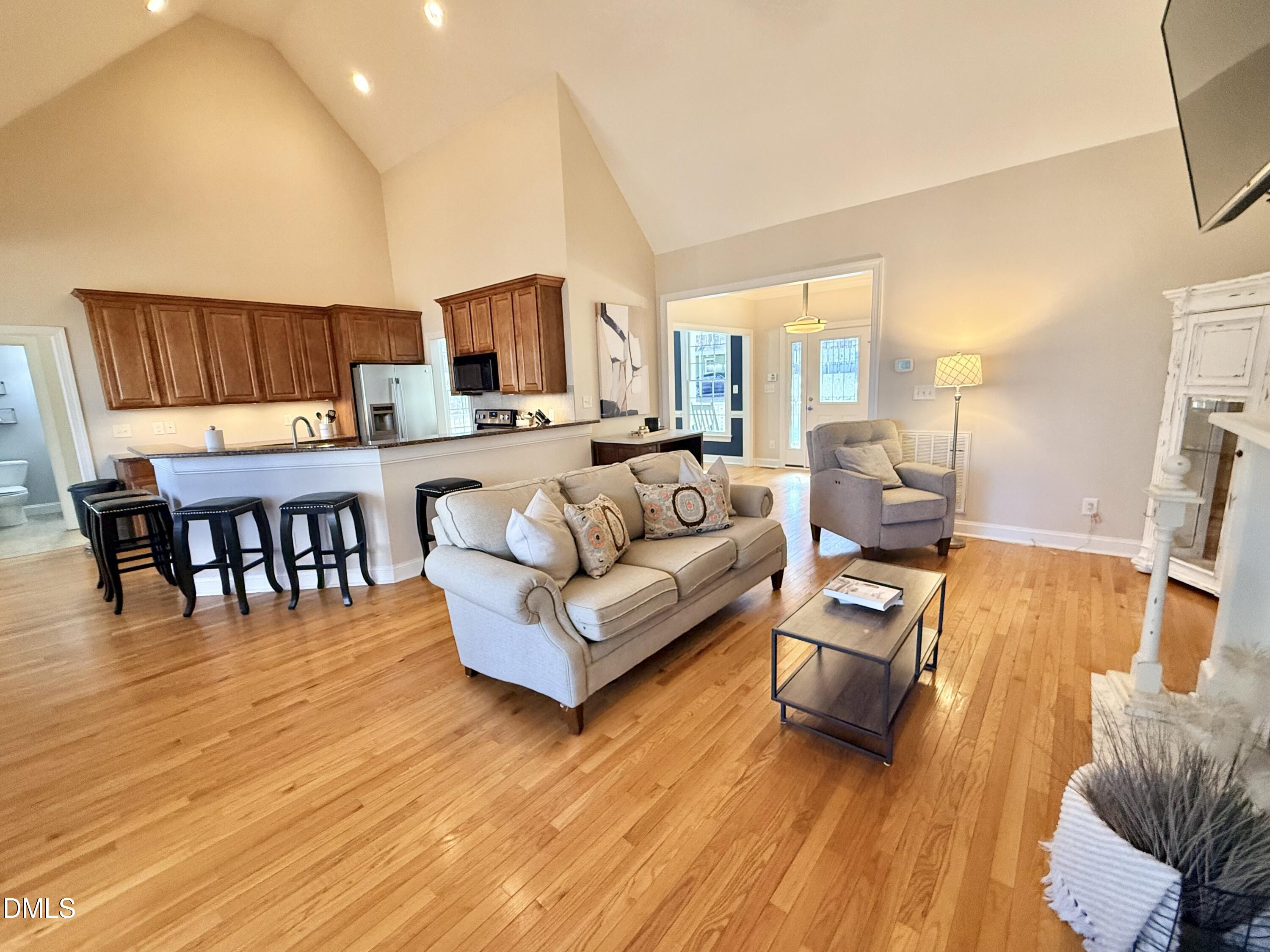 199 Oakwood Lane Roxboro, NC 27574 - Photo 11 of 82 a living room with furniture and a wooden floor