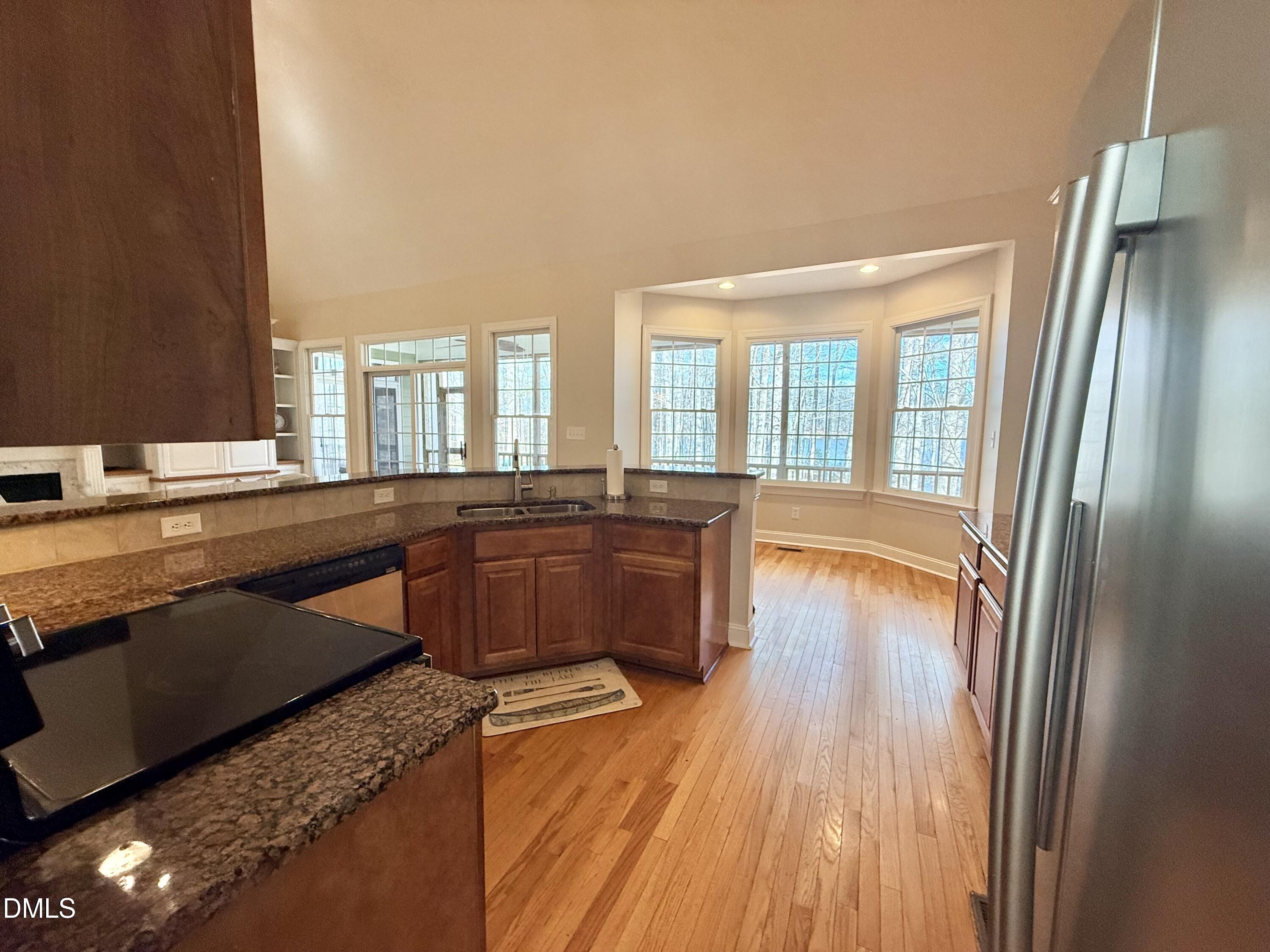 199 Oakwood Lane Roxboro, NC 27574 - Photo 18 of 82 a large kitchen with a large window and stainless steel appliances