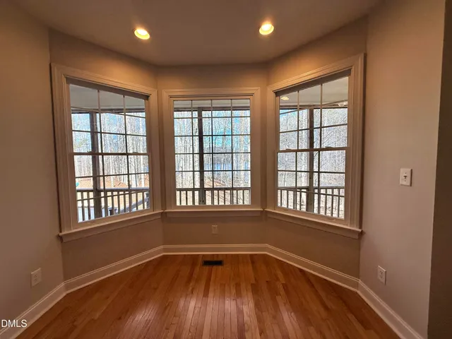 a bedroom with a bed and lamp with window