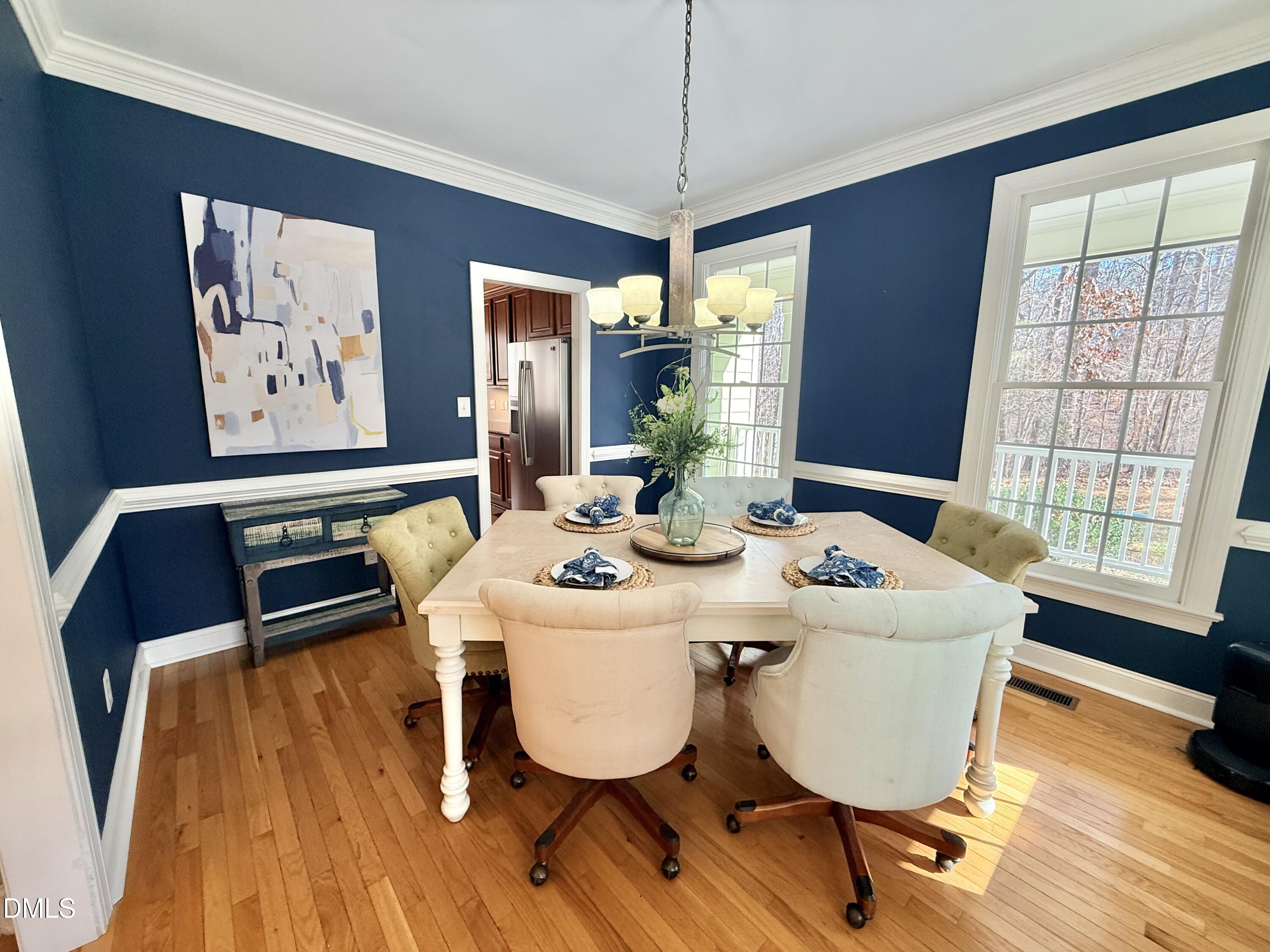 199 Oakwood Lane Roxboro, NC 27574 - Photo 22 of 82 a view of a dining room with furniture window and wooden floor