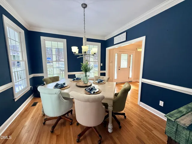 a spacious bedroom with a bed a couch and a window