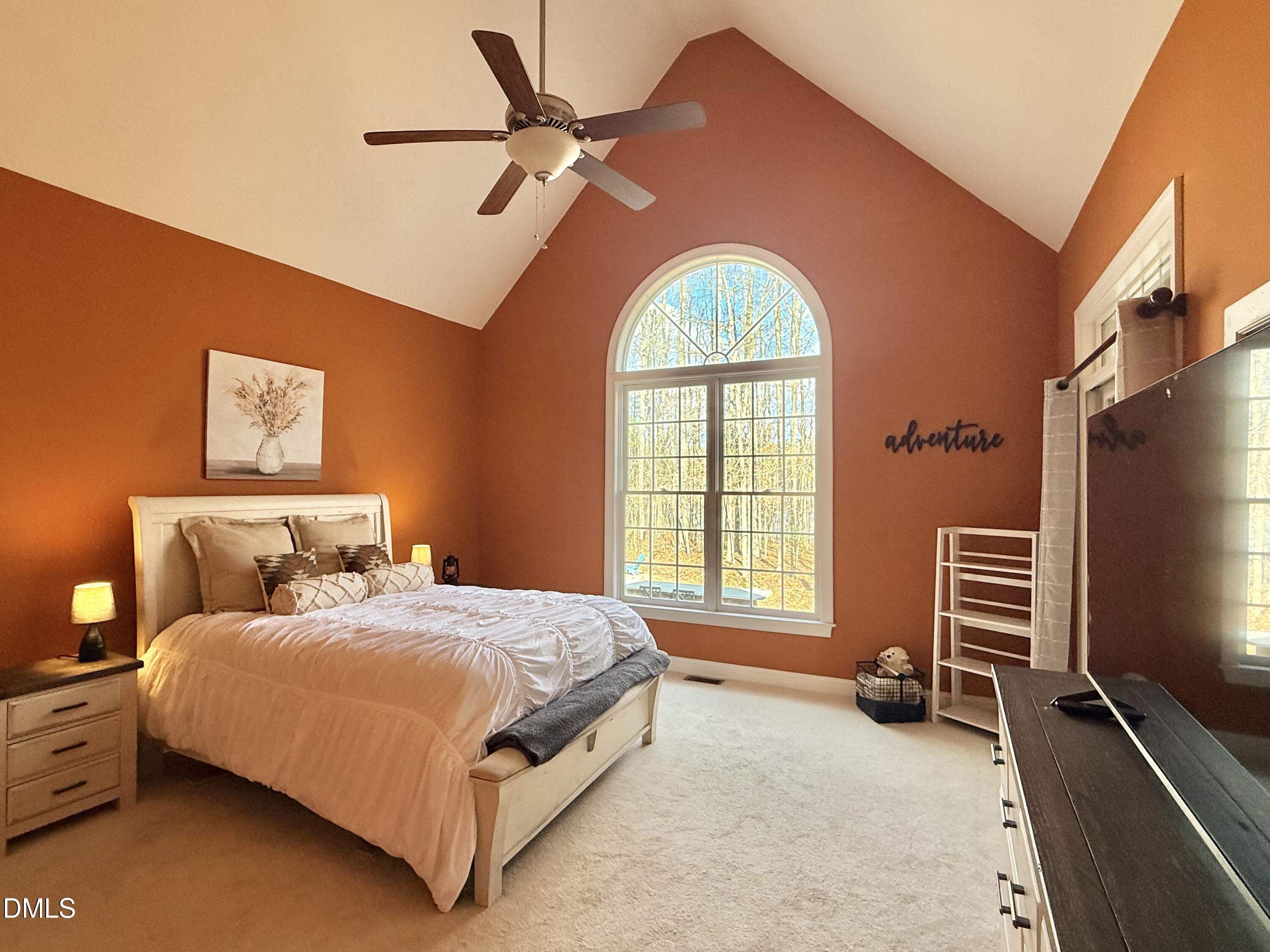 199 Oakwood Lane Roxboro, NC 27574 - Photo 26 of 82 a bedroom with a bed and a flat screen tv