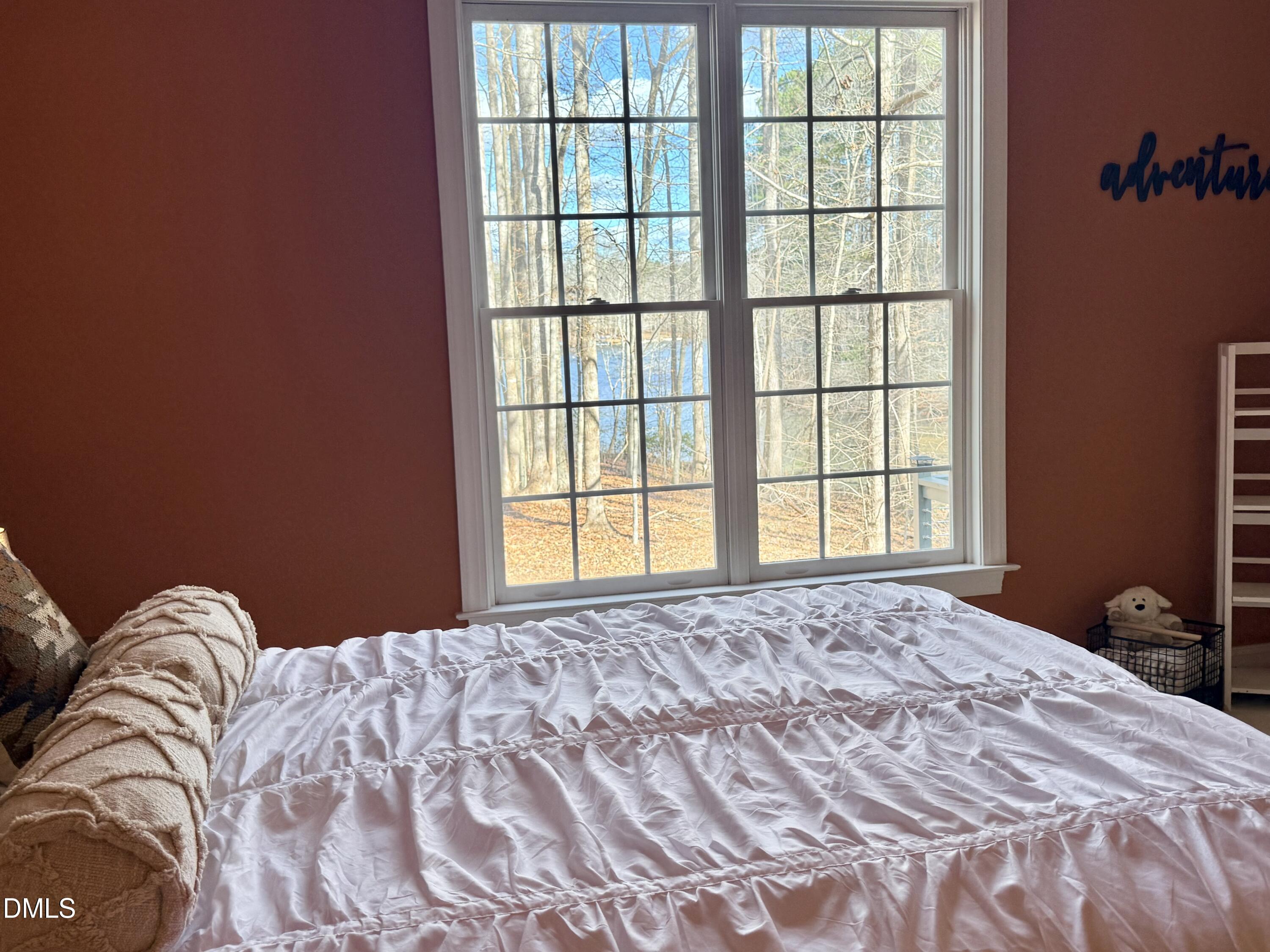 199 Oakwood Lane Roxboro, NC 27574 - Photo 30 of 82 a bedroom with a bed and a window