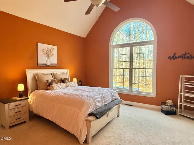 a en suite bathroom with a sink vanity and mirror