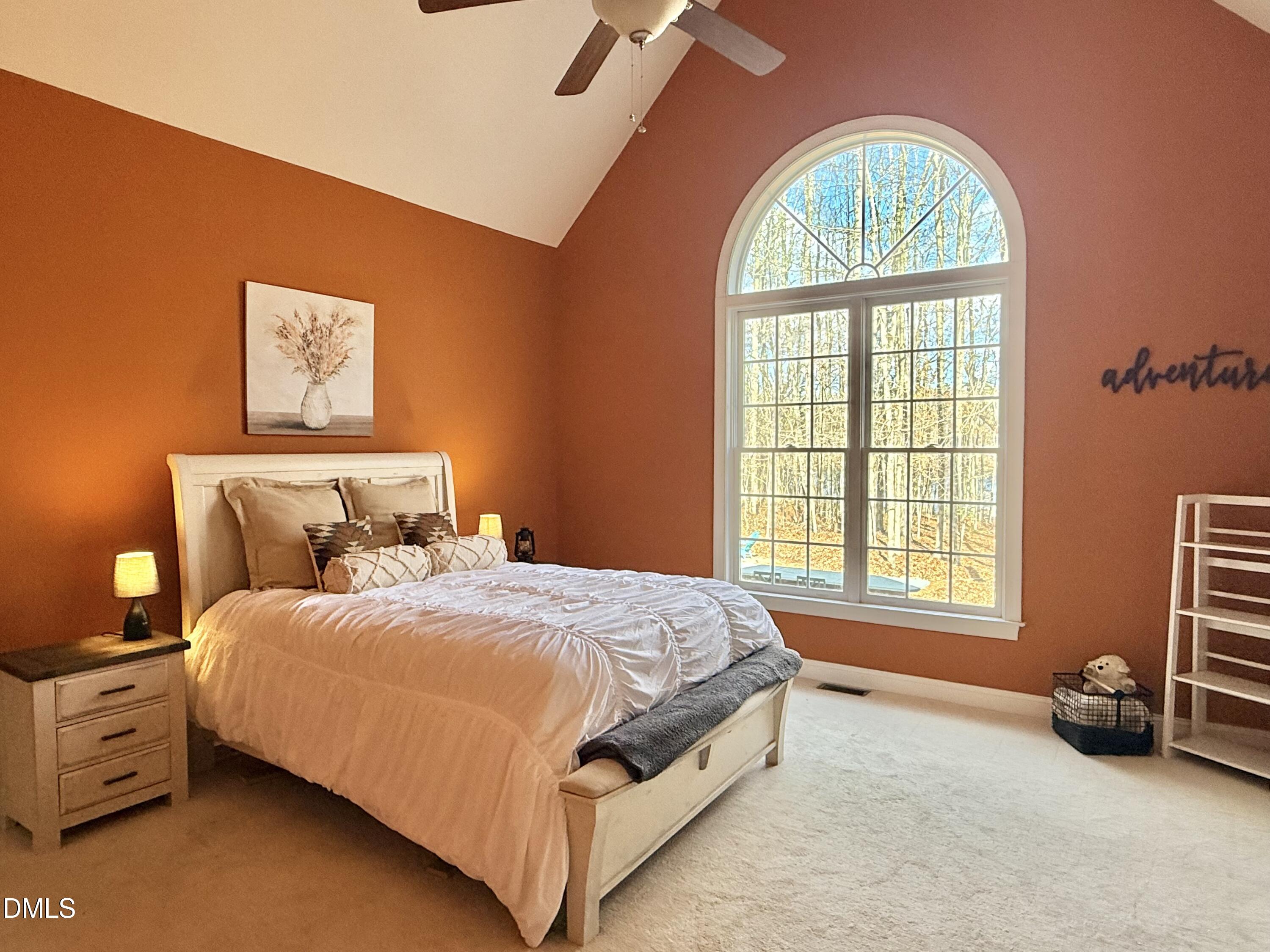 199 Oakwood Lane Roxboro, NC 27574 - Photo 31 of 82 a bedroom with a bed a couch and a window