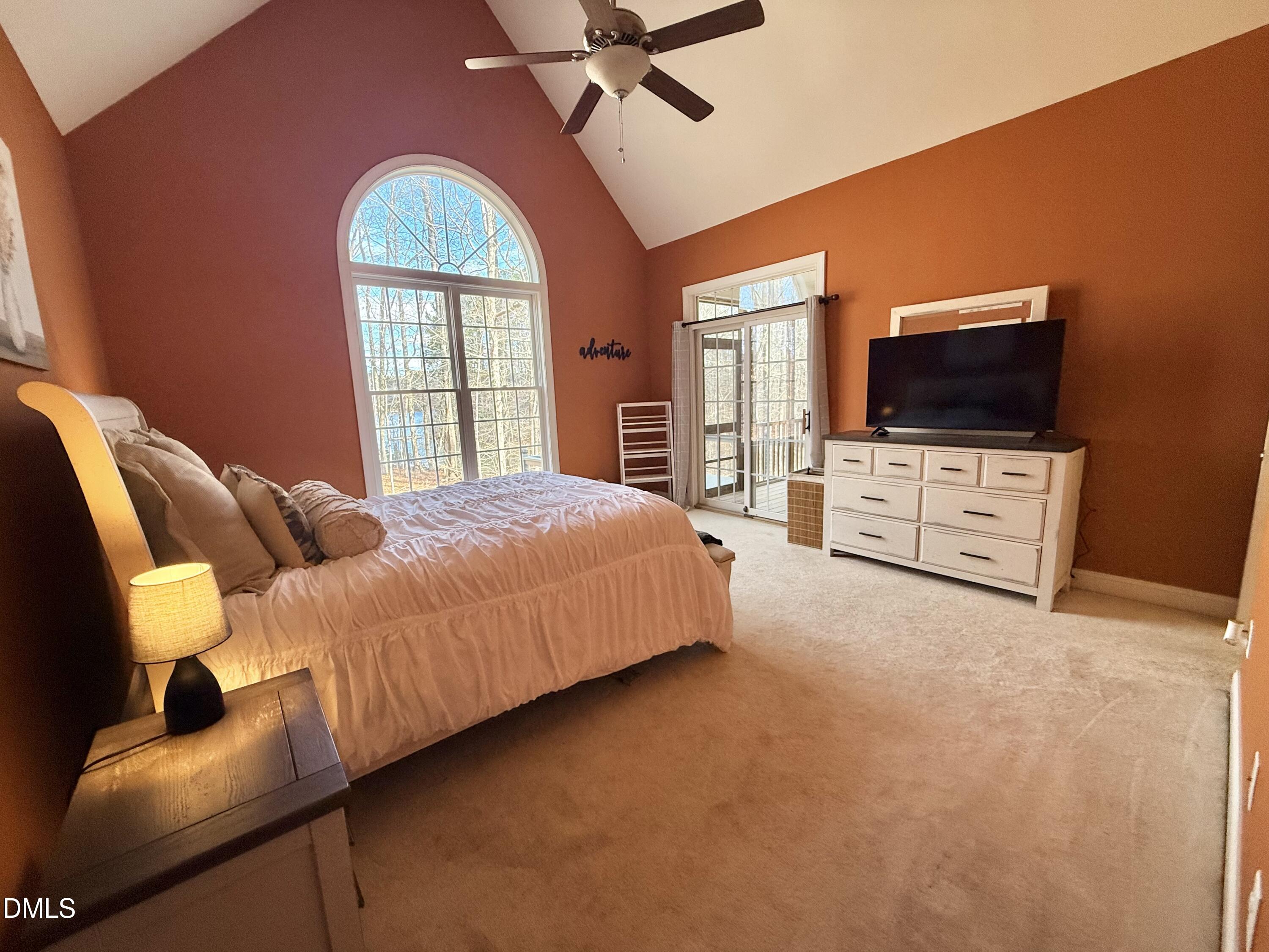 199 Oakwood Lane Roxboro, NC 27574 - Photo 33 of 82 a bedroom with a bed and a flat screen tv