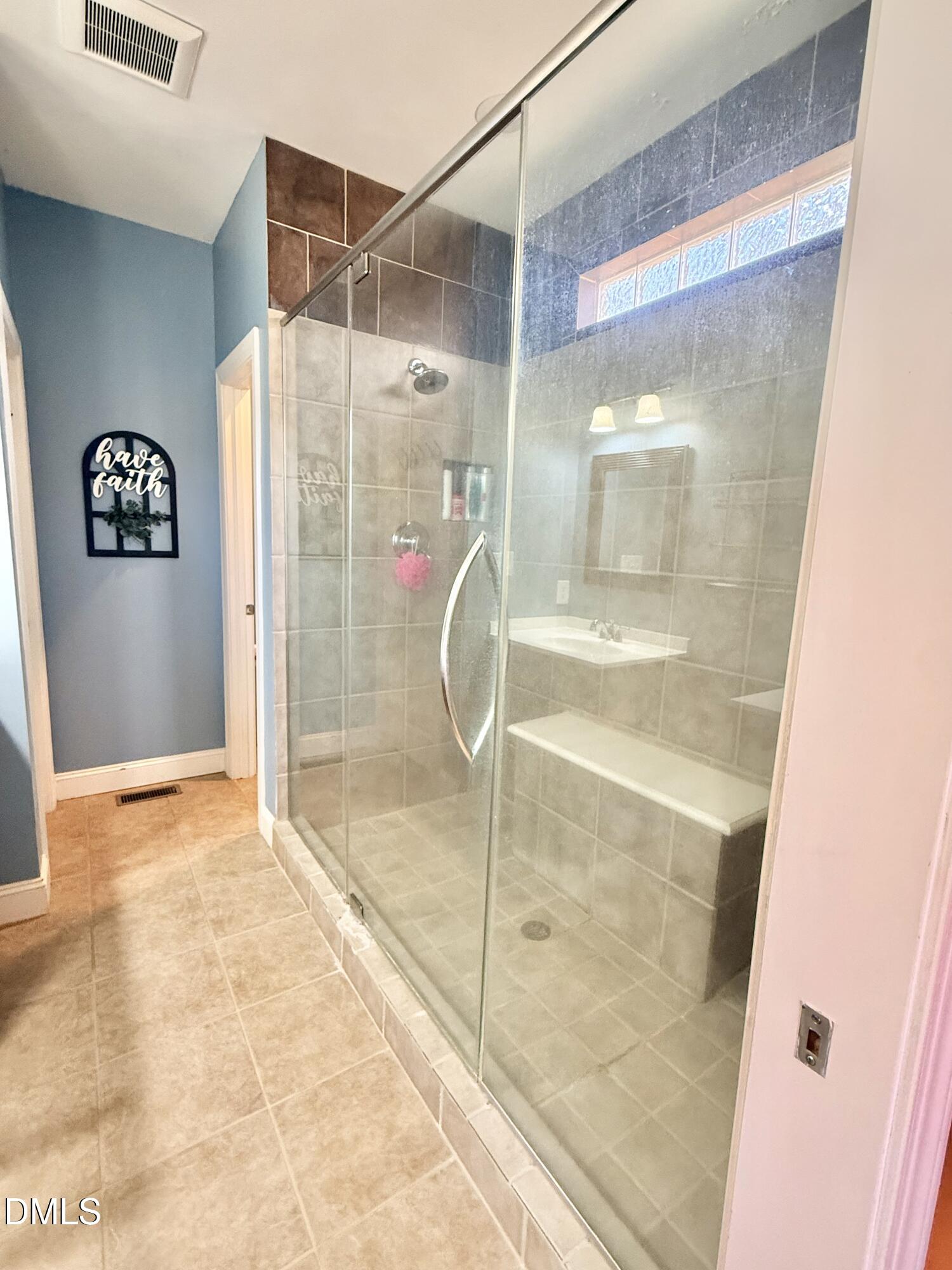 199 Oakwood Lane Roxboro, NC 27574 - Photo 37 of 82 a bathroom with a shower