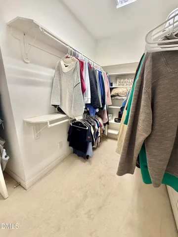 a view of a livingroom with a window and a fireplace