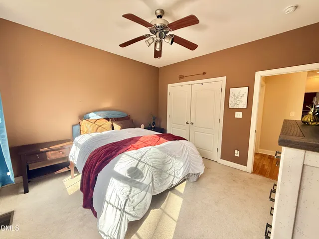 a view of swimming pool with outdoor seating and a yard
