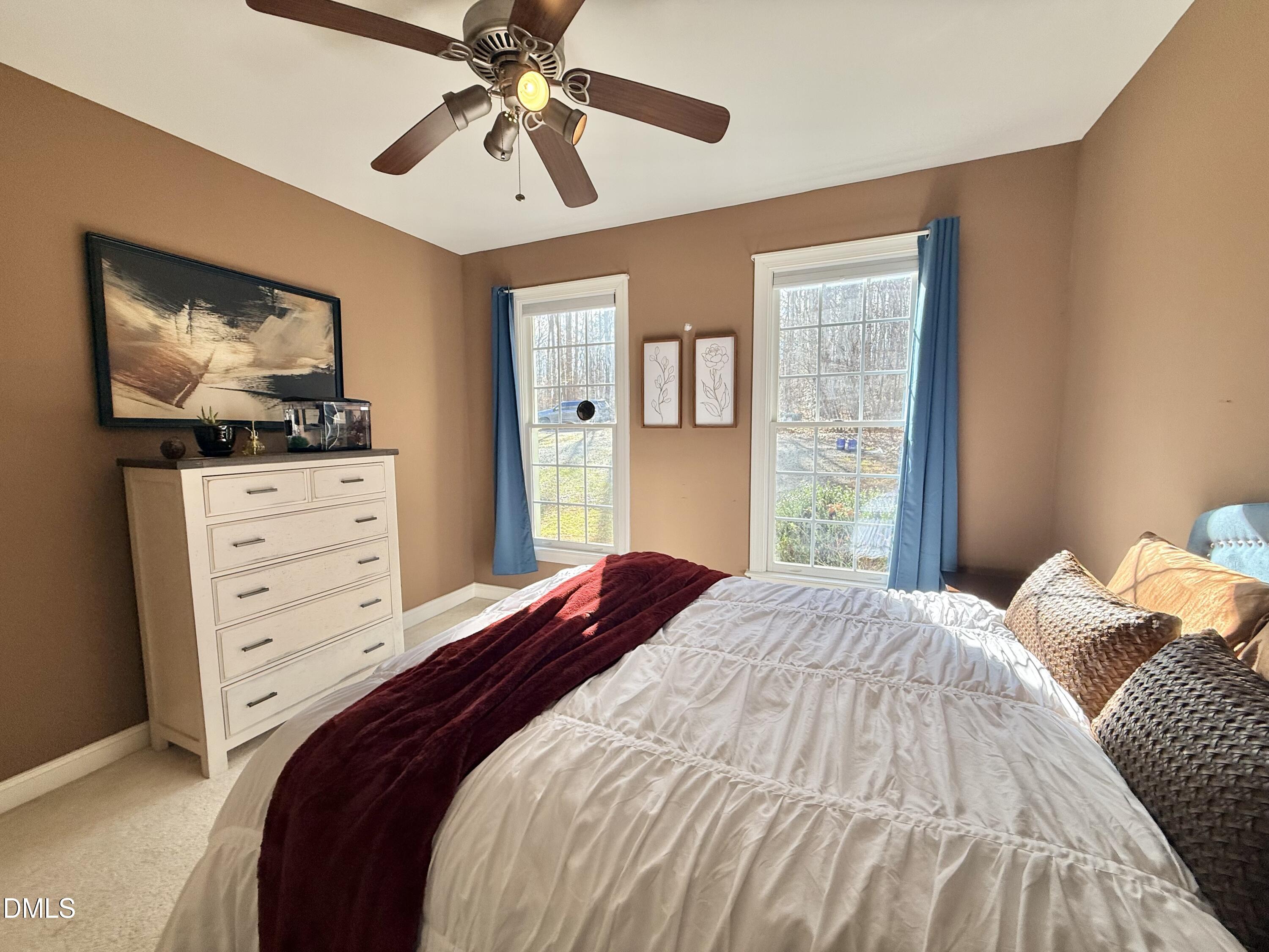 199 Oakwood Lane Roxboro, NC 27574 - Photo 45 of 82 a bedroom with a bed and a flat screen tv