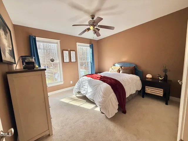 a view of a house with yard and tree s