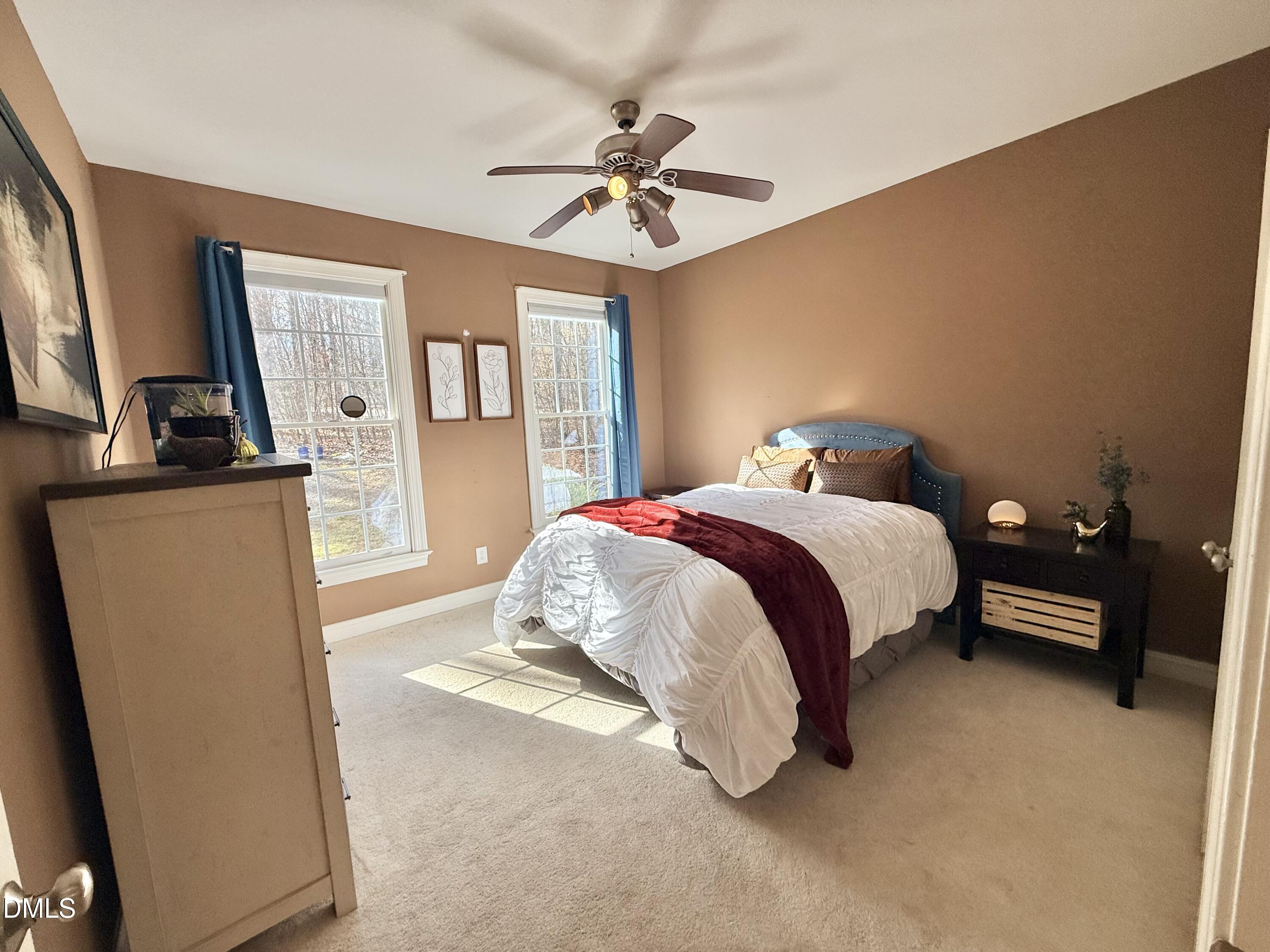 199 Oakwood Lane Roxboro, NC 27574 - Photo 46 of 82 a bed room with a bed mirror and a window