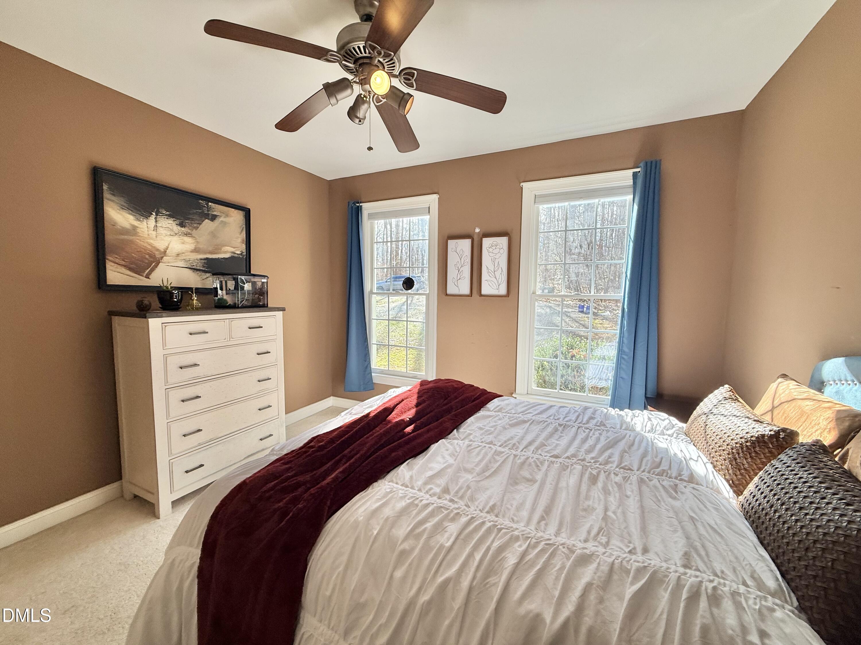 199 Oakwood Lane Roxboro, NC 27574 - Photo 48 of 82 a bedroom with a bed and a flat screen tv