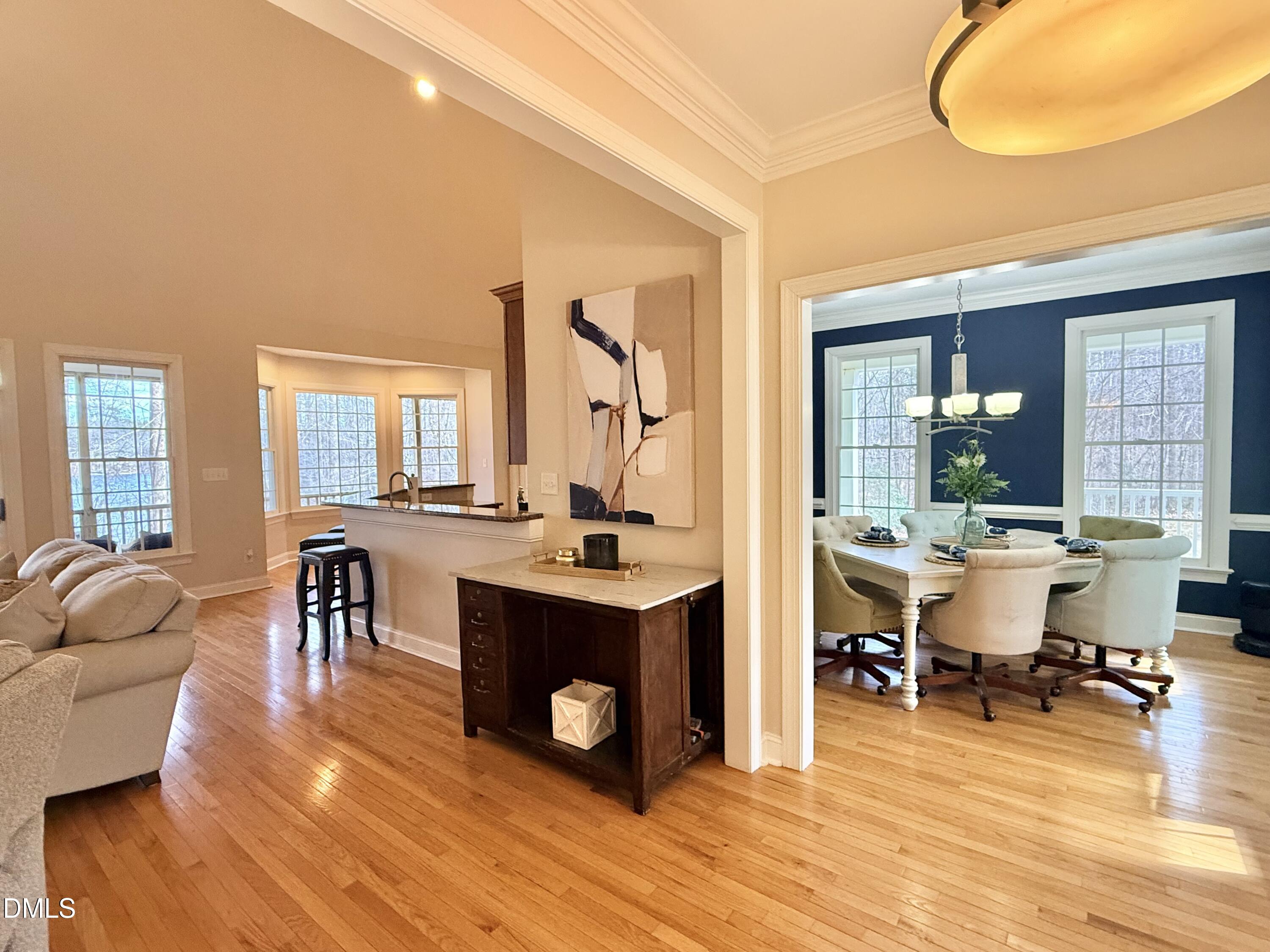 199 Oakwood Lane Roxboro, NC 27574 - Photo 5 of 82 a view of a dining room with furniture and wooden floor