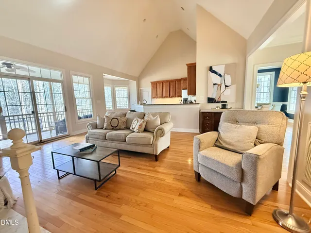 a living room with fireplace furniture and a flat screen tv