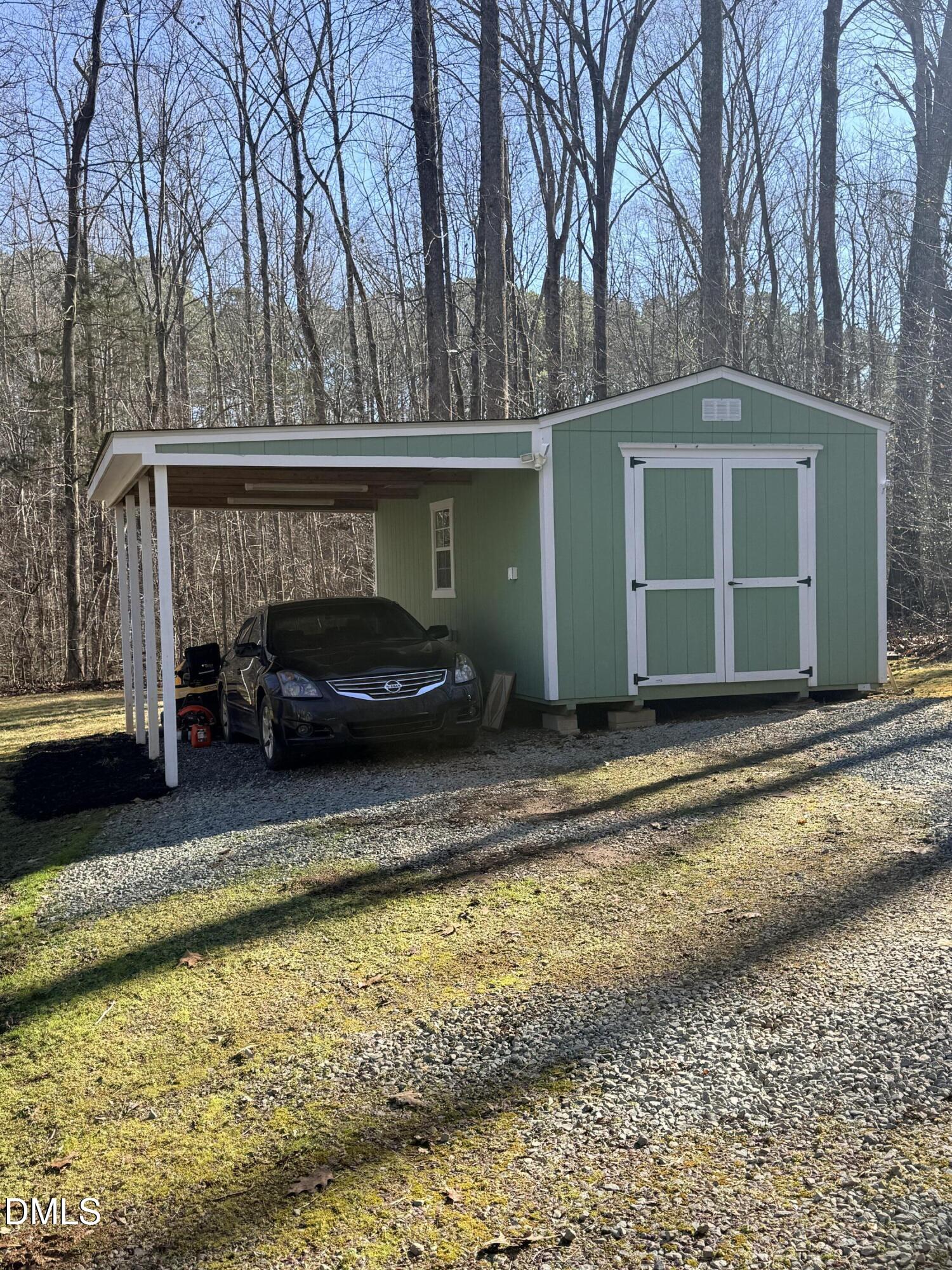 199 Oakwood Lane Roxboro, NC 27574 - Photo 75 of 82 a front view of a house with a yard and trees in the background