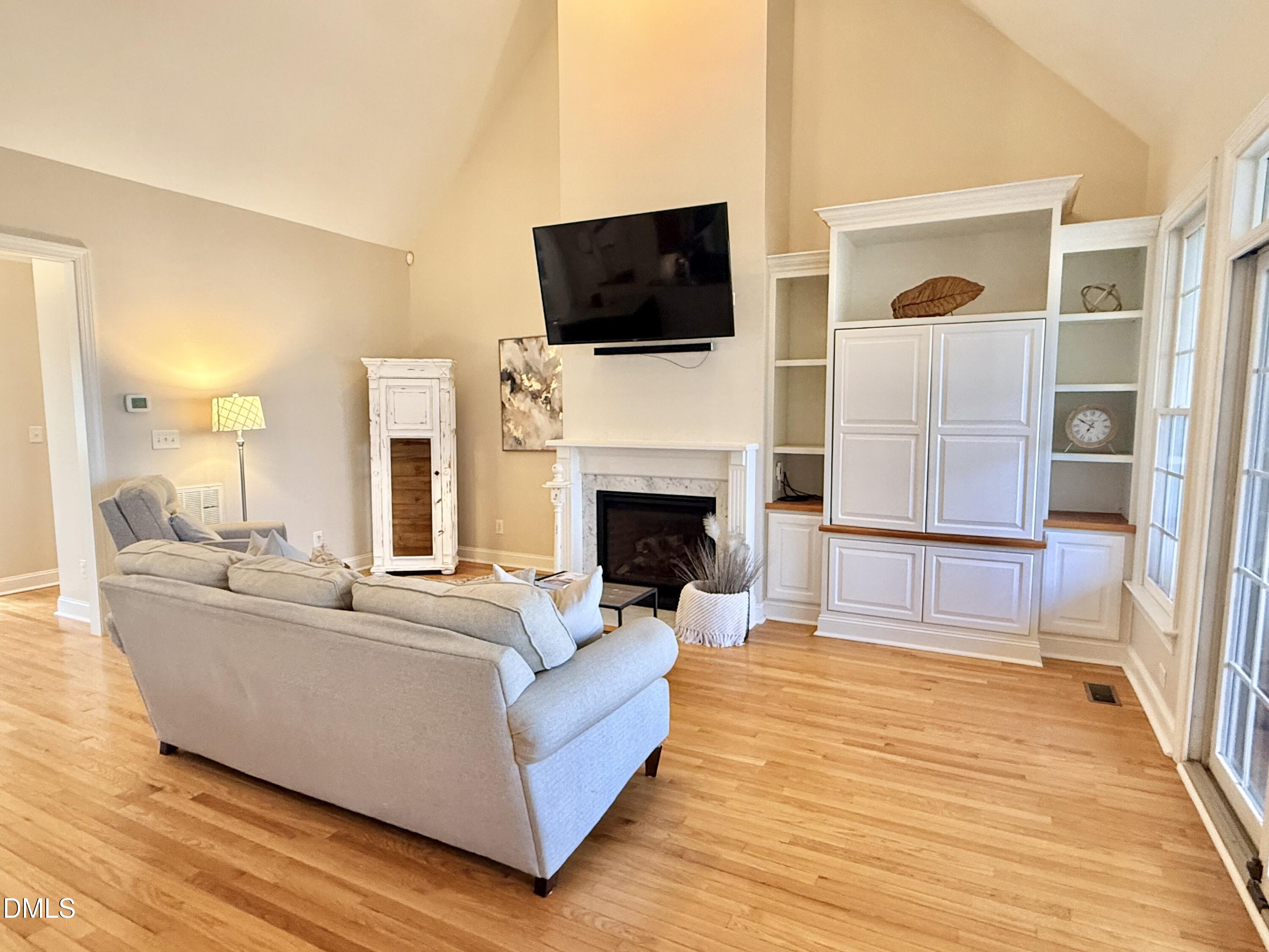 199 Oakwood Lane Roxboro, NC 27574 - Photo 8 of 82 a living room with fireplace furniture and a flat screen tv