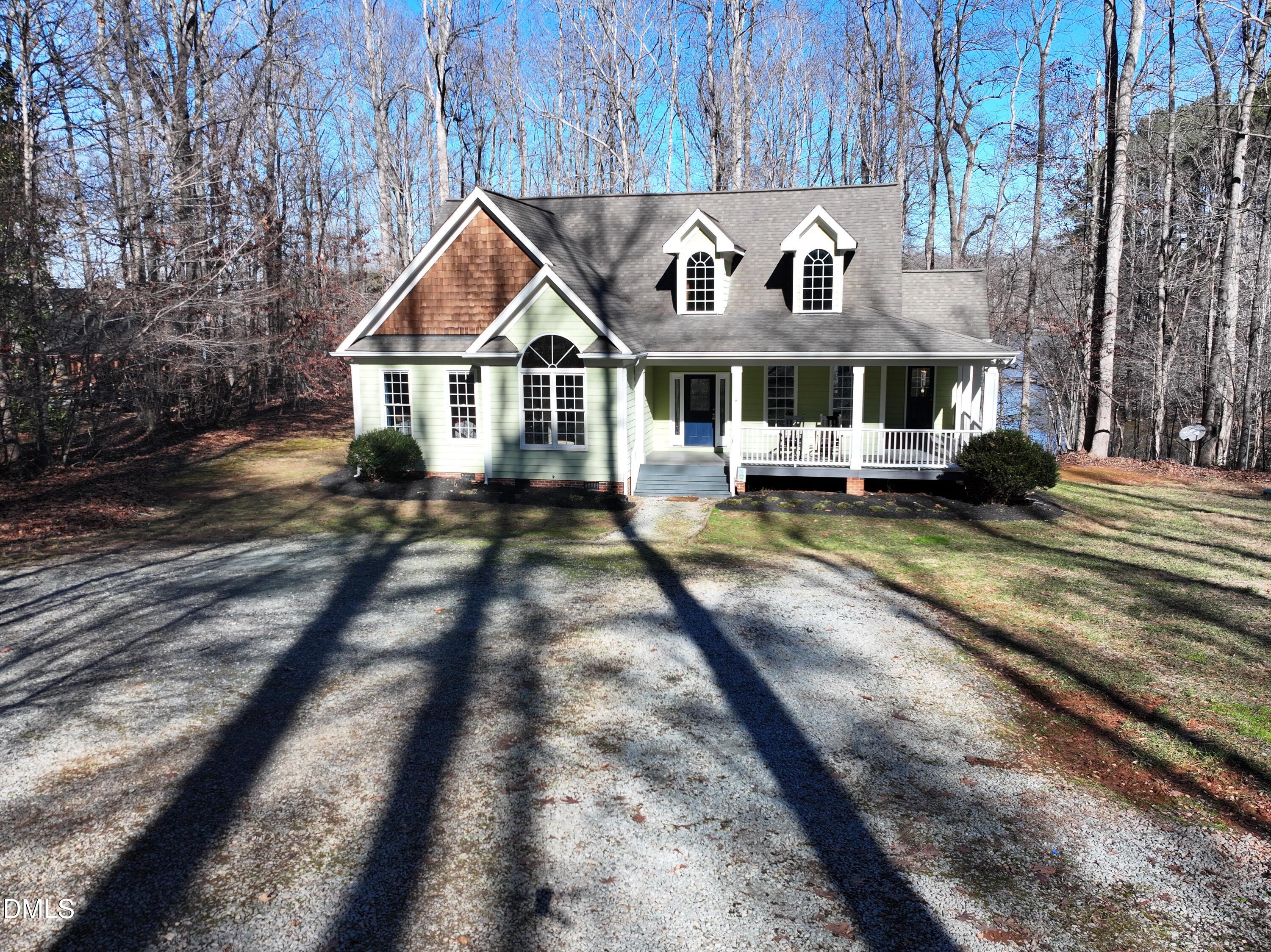 199 Oakwood Lane Roxboro, NC 27574 - Photo 82 of 82 a front view of a house with yard sitting area and garage