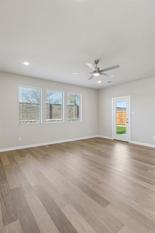 7716 Kingfisher Road Aubrey, TX 76227 - Photo 18 of 39 Living Room in the Holden home plan by Trophy Signature Homes – REPRESENTATIVE PHOTO