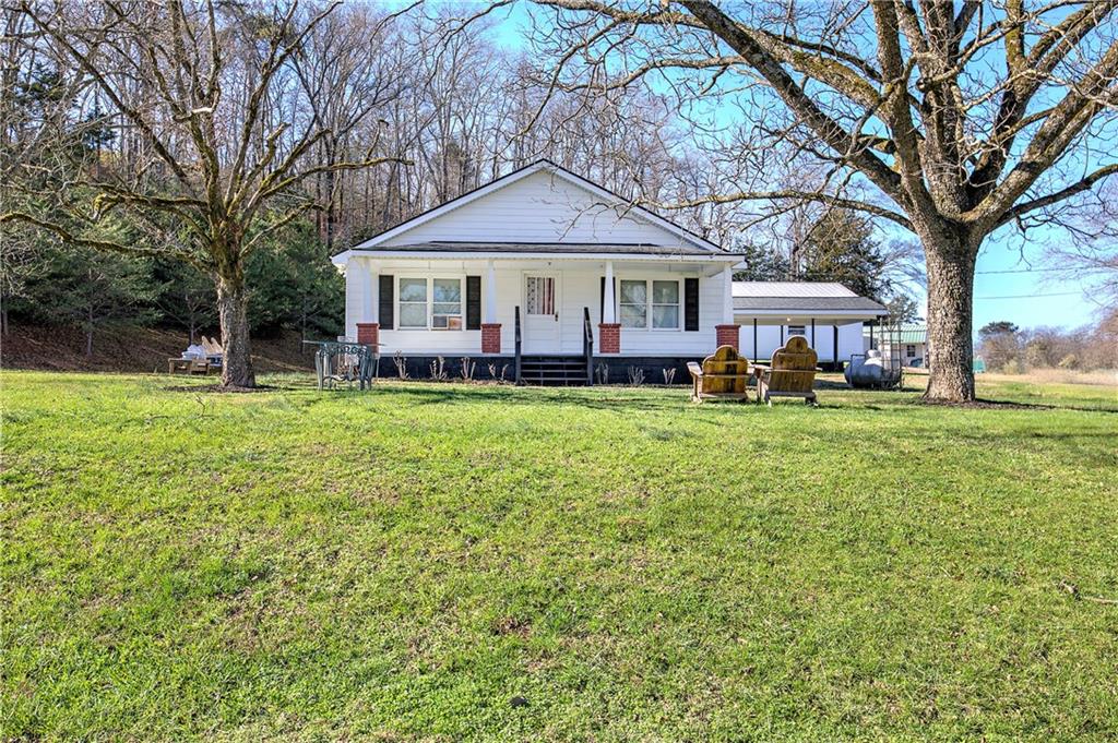 798 Mt Pleasant Road Rydal, GA 30171 - Photo 2 of 31 a front view of a house with garden
