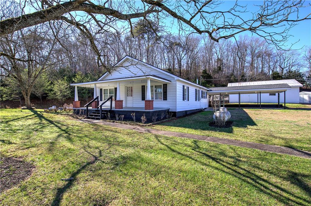798 Mt Pleasant Road Rydal, GA 30171 - Photo 3 of 31 a view of a house with swimming pool and sitting area