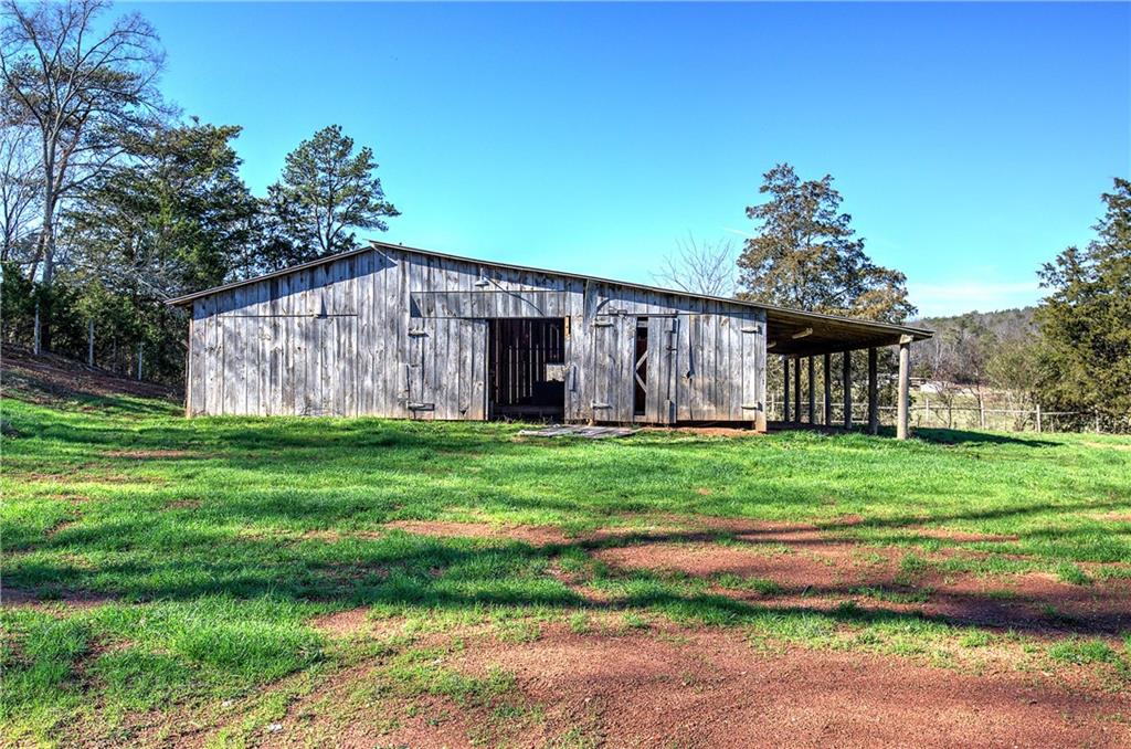 798 Mt Pleasant Road Rydal, GA 30171 - Photo 10 of 31 a view of a back yard with an tree of the house