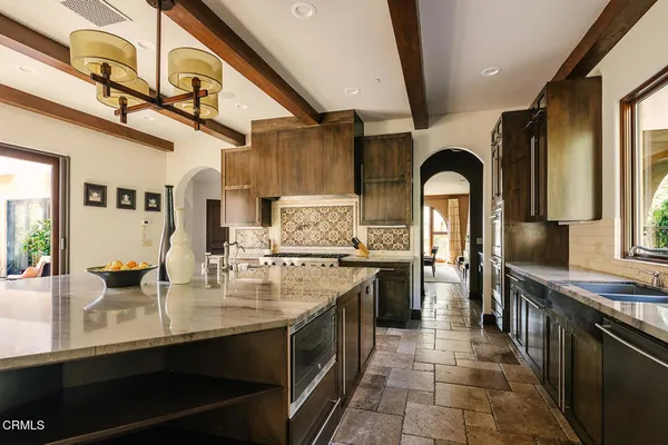 a bathroom with a granite countertop sink toilet a mirror and shower