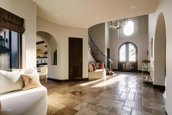 a view of entryway livingroom and hall with wooden floor