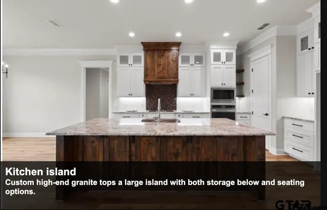 a view of kitchen and kitchen with granite countertop a sink