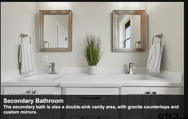 a bathroom with a sink vanity and a mirror