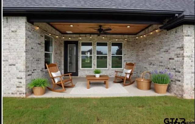 a living room with furniture and a garden