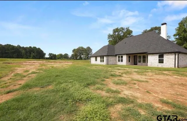 a house with garden in front of it