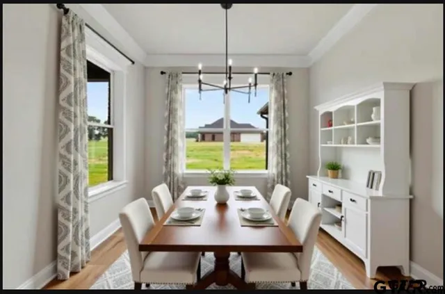 a view of a dining room with furniture window and outside view