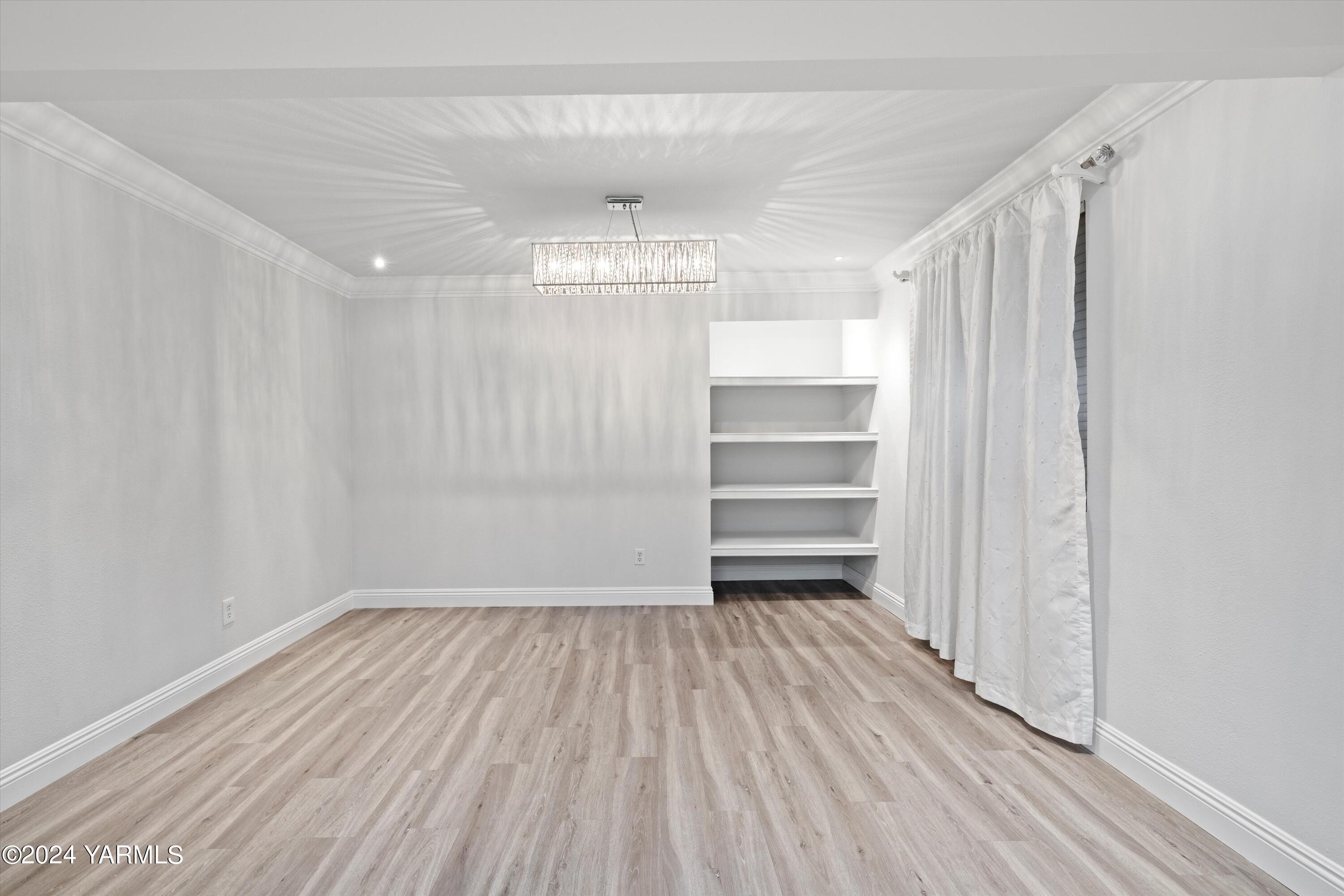 1511 Progressive Road Wapato, WA 98951 - Photo 19 of 36 a view of room with window and wooden floor