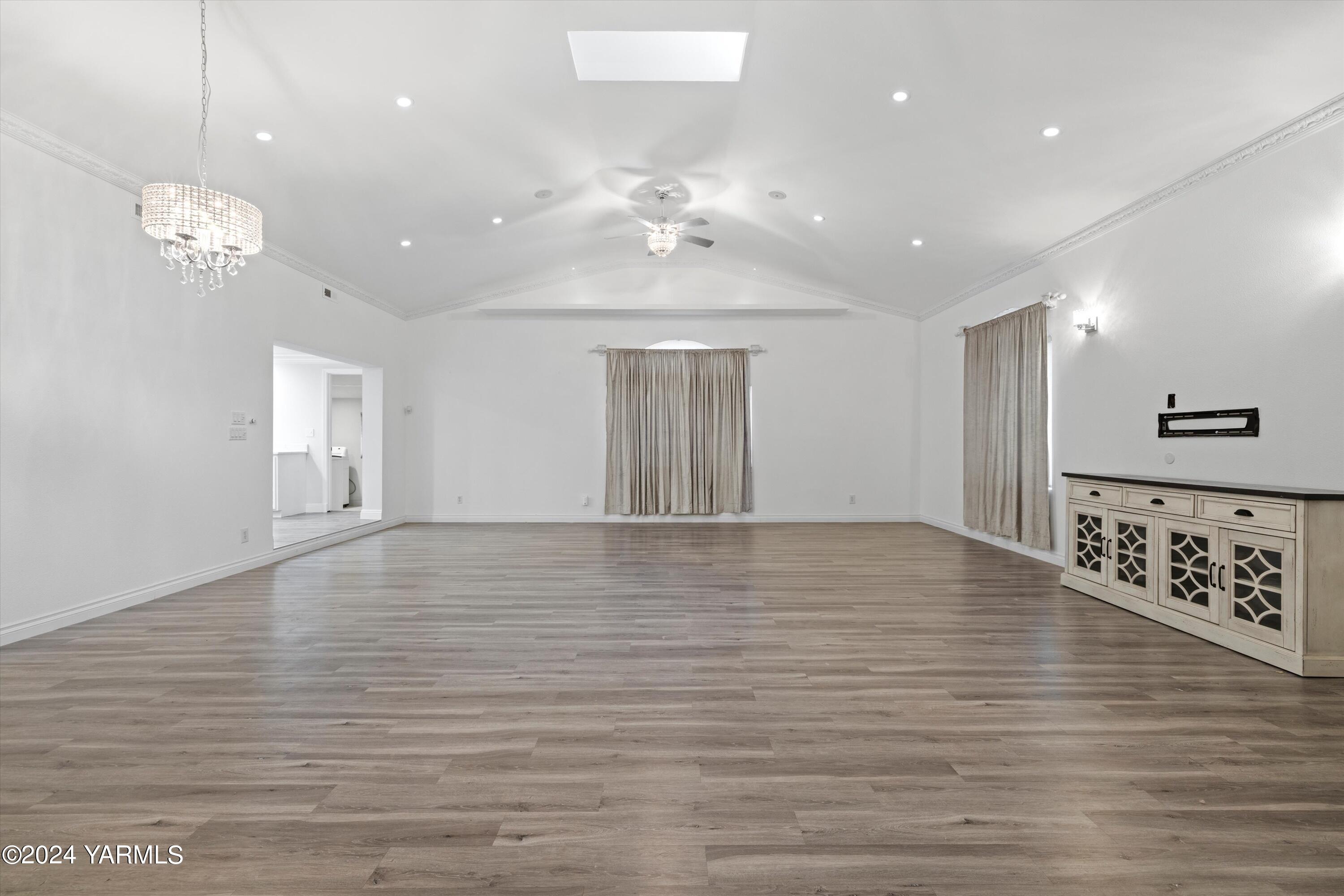 1511 Progressive Road Wapato, WA 98951 - Photo 27 of 36 a view of an empty room with window and wooden floor
