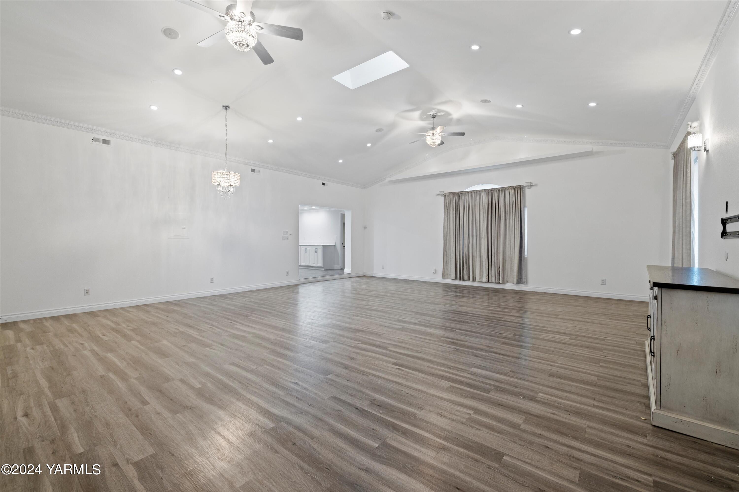 1511 Progressive Road Wapato, WA 98951 - Photo 28 of 36 an empty room with wooden floor and ceiling fan