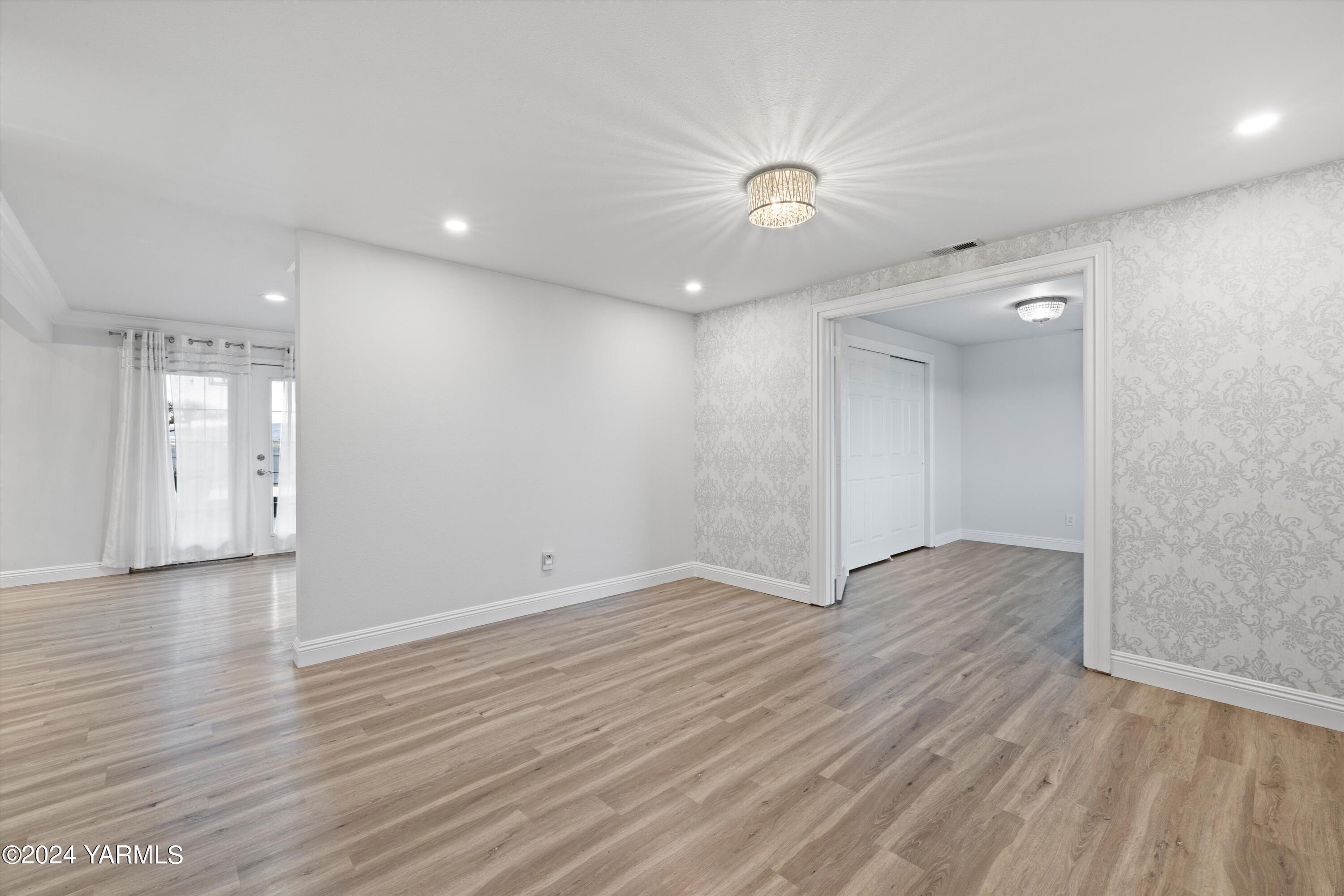 1511 Progressive Road Wapato, WA 98951 - Photo 5 of 36 wooden floor in an empty room with a window