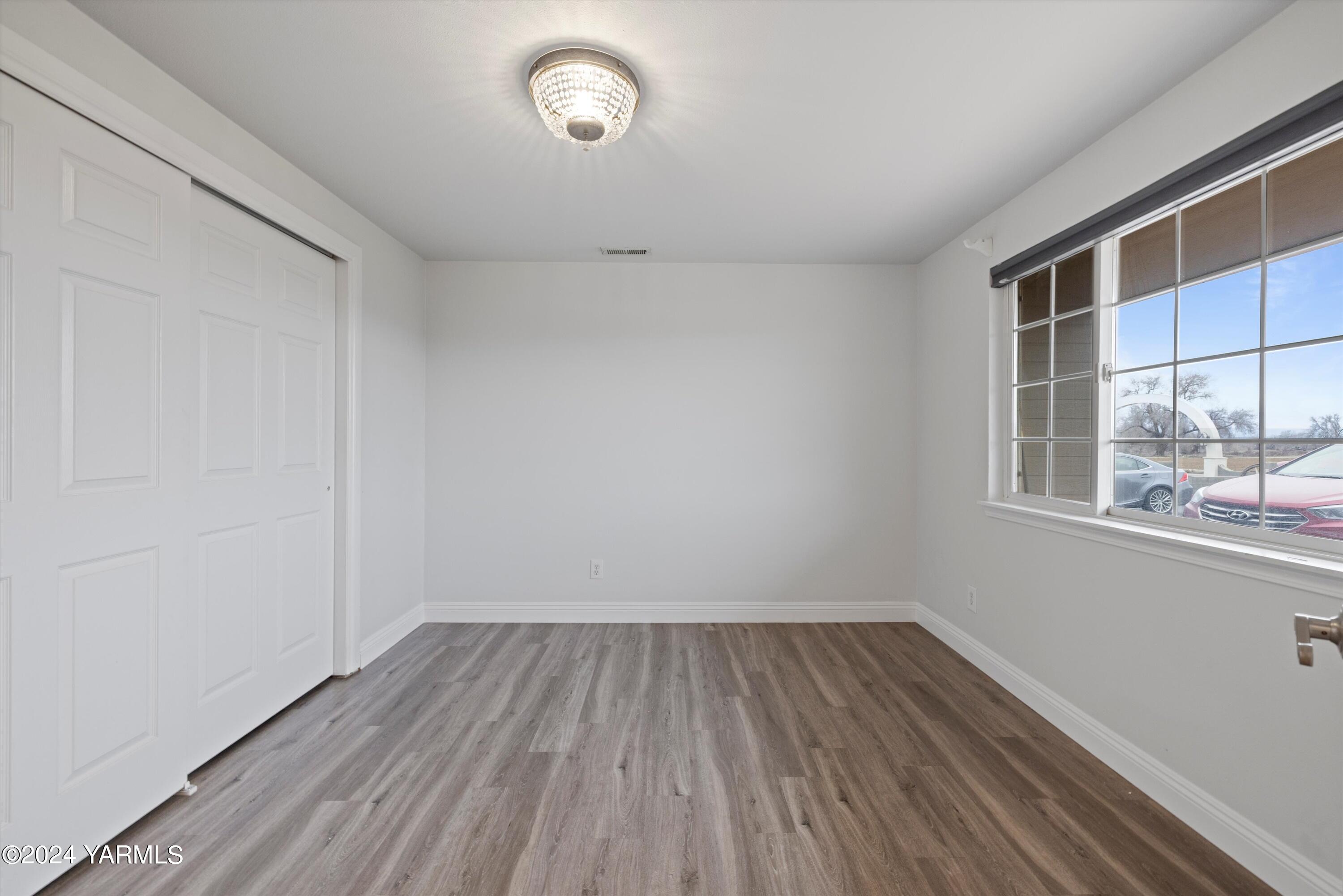1511 Progressive Road Wapato, WA 98951 - Photo 6 of 36 a view of a room with wooden floor and windows